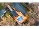 Stunning aerial view showcasing a well-maintained home with a private in-ground pool and large deck at 1235 Sunset Dr, Charleston, SC 29407