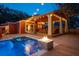 Beautiful backyard with a pool, outdoor kitchen, and dining area perfect for entertaining at 1235 Sunset Dr, Charleston, SC 29407