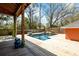 Outdoor living space featuring a sparkling swimming pool, deck, and covered area for gatherings at 1235 Sunset Dr, Charleston, SC 29407