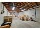 Unfinished basement offers ample storage space and features concrete block walls and an exposed ceiling at 1235 Sunset Dr, Charleston, SC 29407