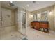 A bright bathroom features double vanity, a glass shower, beige tile and neutral-toned walls at 1235 Sunset Dr, Charleston, SC 29407