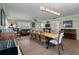 Open concept dining room features hardwood floors, a large wooden table, and a stylish light fixture at 1235 Sunset Dr, Charleston, SC 29407