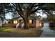 Charming brick home with a well-manicured front yard and a detached garage at 1235 Sunset Dr, Charleston, SC 29407