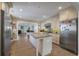 Bright kitchen featuring a large island, stainless steel appliances, granite counters, and seamless living area access at 1235 Sunset Dr, Charleston, SC 29407