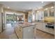 Kitchen with granite countertops, stainless steel appliances, a spacious center island, and backyard views at 1235 Sunset Dr, Charleston, SC 29407