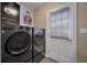 Laundry room features LG front load washer and dryer, blinds, and neutral paint colors at 1235 Sunset Dr, Charleston, SC 29407