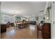 Bright and airy living room with hardwood floors, a large dining table, and a comfortable seating area at 1235 Sunset Dr, Charleston, SC 29407