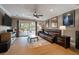 Relaxing living room with hardwood floors, a leather sofa, and access to a deck at 1235 Sunset Dr, Charleston, SC 29407