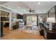 Comfortable living room with hardwood floors, leather seating, and an open doorway to the bedroom at 1235 Sunset Dr, Charleston, SC 29407