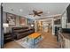 Open-concept living room showcasing hardwood floors, leather furniture, and easy access to the kitchen at 1235 Sunset Dr, Charleston, SC 29407
