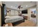 Cozy main bedroom features a ceiling fan, hardwood floors, and an ensuite bathroom entrance at 1235 Sunset Dr, Charleston, SC 29407