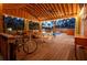 Inviting covered deck with dining table, lounge, in-ground pool and string lights perfect for entertaining at 1235 Sunset Dr, Charleston, SC 29407