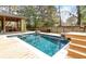 Backyard pool with a wooden deck, outdoor seating, and covered area for entertaining guests at 1235 Sunset Dr, Charleston, SC 29407