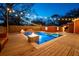 Stunning pool and backyard, highlighted by nighttime lighting, seating and spa at 1235 Sunset Dr, Charleston, SC 29407
