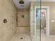 A luxurious walk-in shower features a glass door, multiple shower heads and a built in bench at 1235 Sunset Dr, Charleston, SC 29407