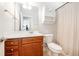 Well-lit bathroom features a wood vanity, spacious mirror, and classic fixtures at 125 Gaslight Blvd, Summerville, SC 29483