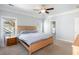 Comfortable bedroom featuring neutral walls, carpet, a fan, and an adjoining bathroom at 125 Gaslight Blvd, Summerville, SC 29483