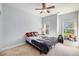 Well-lit bedroom with carpet, fan, and natural light from large windows at 125 Gaslight Blvd, Summerville, SC 29483