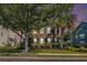 Charming two-story home with a brick facade, mature landscaping, and lush greenery at 125 Gaslight Blvd, Summerville, SC 29483