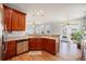 Open kitchen with cherry cabinets, granite countertops, stainless steel appliances, and hardwood floors at 125 Gaslight Blvd, Summerville, SC 29483