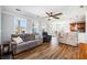 Comfortable living room with hardwood floors, ceiling fan, and lots of natural light at 125 Gaslight Blvd, Summerville, SC 29483