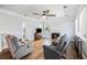 Spacious living room featuring hardwood floors, a fireplace, and a ceiling fan at 125 Gaslight Blvd, Summerville, SC 29483