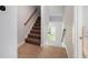 Carpeted stairway featuring wood railing and natural light at 125 Gaslight Blvd, Summerville, SC 29483