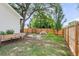 Spacious backyard featuring a play area, lush green grass, and a wood privacy fence at 1302 Aubry Dr, Moncks Corner, SC 29461