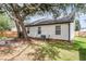 Spacious backyard with a fire pit and mature trees, and a wood fence at 1302 Aubry Dr, Moncks Corner, SC 29461