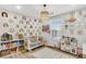 This bright Bedroom has cute rainbow wall decor, a toy kitchen, and a modern light fixture at 1302 Aubry Dr, Moncks Corner, SC 29461