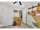 This bedroom includes an open door to another room, guitar decor, wood floors, and neutral walls at 1302 Aubry Dr, Moncks Corner, SC 29461