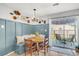 Cozy dining nook with custom banquette seating and a view of the outdoor patio at 1302 Aubry Dr, Moncks Corner, SC 29461