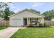 Charming single-story home featuring a welcoming front porch and a well-maintained front yard at 1302 Aubry Dr, Moncks Corner, SC 29461