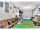 Spacious garage transformed into a recreational area with putting green and seating at 1302 Aubry Dr, Moncks Corner, SC 29461