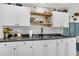 Kitchen featuring white cabinetry, dark countertops, and modern fixtures at 1302 Aubry Dr, Moncks Corner, SC 29461