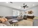 Comfortable living room with a large sectional sofa, neutral tones, and stylish decor at 1302 Aubry Dr, Moncks Corner, SC 29461
