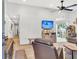 Inviting living room with a ceiling fan, a wall-mounted TV, and sliding glass doors to the backyard at 1302 Aubry Dr, Moncks Corner, SC 29461