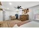 This main bedroom features wood floors, a ceiling fan, a wooden dresser, and neutral-toned decor at 1302 Aubry Dr, Moncks Corner, SC 29461