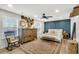 This spacious main bedroom features stylish decor, a blue accent wall, and an orange-toned rug at 1302 Aubry Dr, Moncks Corner, SC 29461