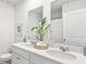 Bright bathroom featuring a double sink vanity, modern fixtures, and decorative accents at 141 Haventree Ct, Summerville, SC 29486