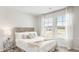Cozy bedroom with large windows, neutral decor, and plush bedding for a relaxing atmosphere at 141 Haventree Ct, Summerville, SC 29486