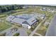 Stunning aerial view of community pool with lake, lounge areas, and clubhouse at 157 Pocket Bend Cir, Summerville, SC 29486