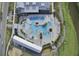 Aerial shot of community pool, lounge areas, walkways, and adjacent pond at 157 Pocket Bend Cir, Summerville, SC 29486