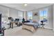Bright bedroom with natural light, desk, fan, and decorated with an assortment of personal effects at 157 Pocket Bend Cir, Summerville, SC 29486