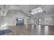 Spacious clubhouse featuring high ceilings, wood floors, a modern ceiling fan, and ample seating at 157 Pocket Bend Cir, Summerville, SC 29486