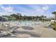 Inviting community pool featuring in-pool lounge chairs and shady umbrellas at 157 Pocket Bend Cir, Summerville, SC 29486