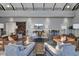 Cozy lounge area featuring modern sofas, armchairs, decorative lamps, and a flat-screen TV at 157 Pocket Bend Cir, Summerville, SC 29486