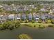 Stunning aerial view of waterfront homes, showcasing beautifully landscaped yards and serene lake views in a desirable community at 1588 Paradise Lake Dr, Mount Pleasant, SC 29464