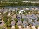 Aerial view of neighborhood with lake view, showcasing the property's location at 1588 Paradise Lake Dr, Mount Pleasant, SC 29464