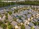 Aerial view of the residential neighborhood with lake and tree lined streets at 1588 Paradise Lake Dr, Mount Pleasant, SC 29464